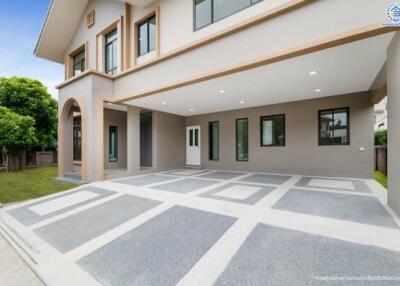 Modern two-story house exterior with spacious driveway