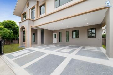 Modern two-story house exterior with spacious driveway