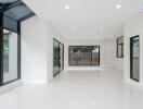 Spacious living room with large windows and natural light