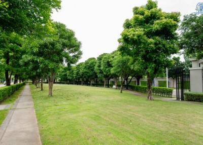 Well-maintained garden with trees and pathway