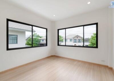 Empty bedroom with large windows