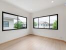 Empty bedroom with large windows