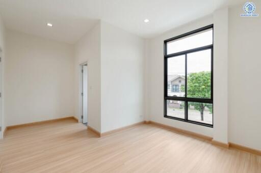 Spacious living room with large windows