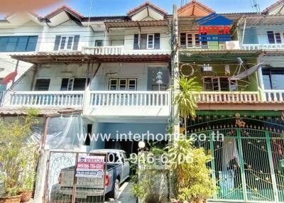 Front view of a building with multiple attached houses