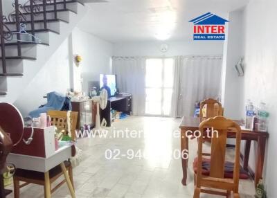 Main living area with dining space and staircase