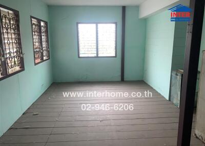 Empty room with windows and wooden floor