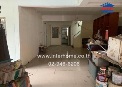 Interior view of a property showing an empty room with stairs