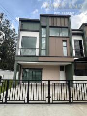 Modern two-story house exterior with large driveway