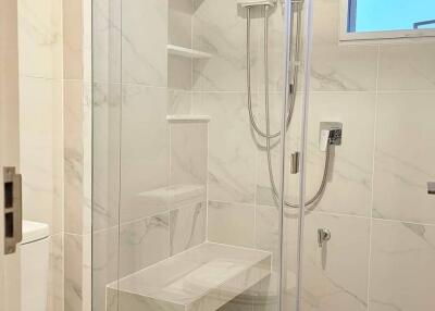 Modern bathroom with glass shower door