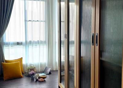 Bedroom with wooden wardrobes and a window