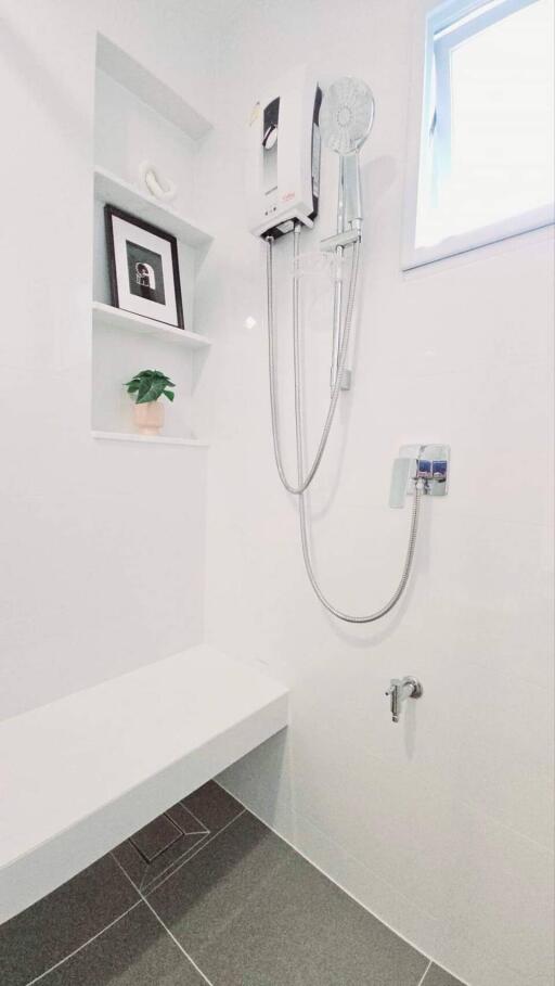 Modern bathroom with shower and wall-mounted water heater