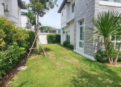 Exterior view of a modern house with a garden