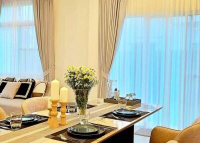 Elegant dining area with table setting and modern decor