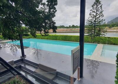 Modern outdoor swimming pool with greenery