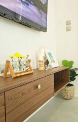 modern living room with wooden console and decor items