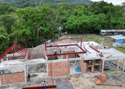 Construction of a building surrounded by greenery