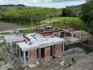 Construction site of a new property with visible framework and brick structure