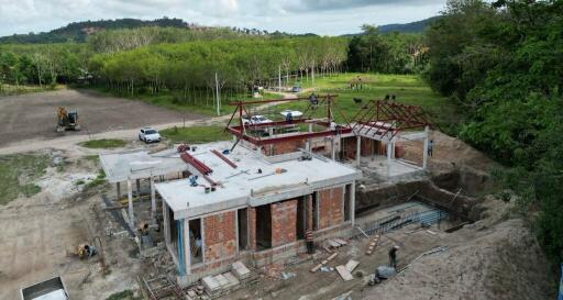 Construction site of a new property with visible framework and brick structure