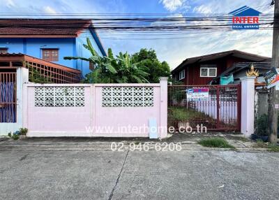 Exterior view of residential property including fence and gate