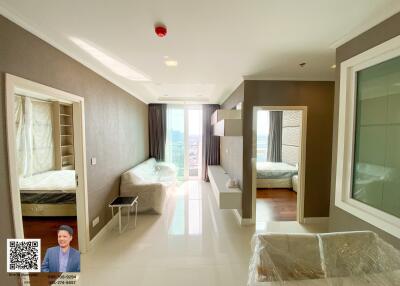 Spacious and well-lit apartment with a modern design featuring two bedrooms and a living area