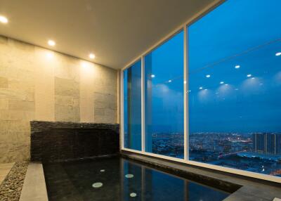 Indoor rooftop pool with city view