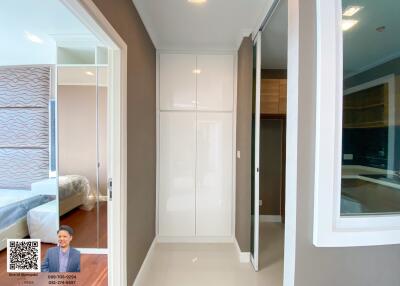 Bedroom entrance with view of fitted wardrobes and bed