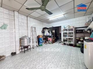 Spacious kitchen with various appliances and storage