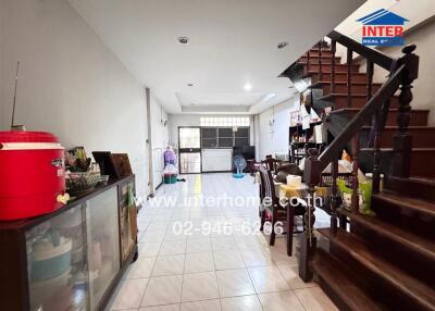 Main living space with stairs and dining area