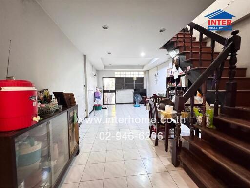 Main living space with stairs and dining area