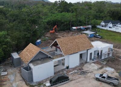 Under-construction house with surrounding area