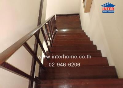 Wooden staircase with handrail