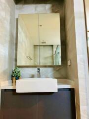 Modern bathroom with large mirror and sink