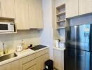 Modern kitchen with wooden cabinets and stainless steel appliances