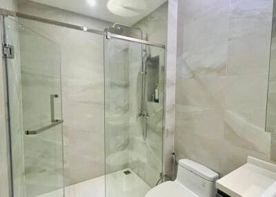 Modern bathroom with glass shower and toilet