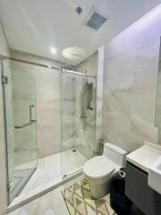 Modern bathroom with glass shower and toilet