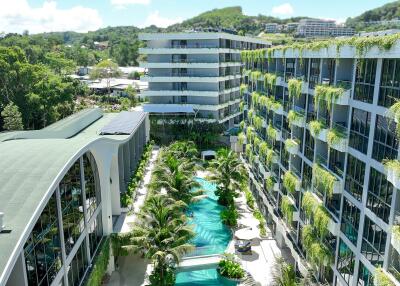 Exterior view of modern apartment complex with swimming pool