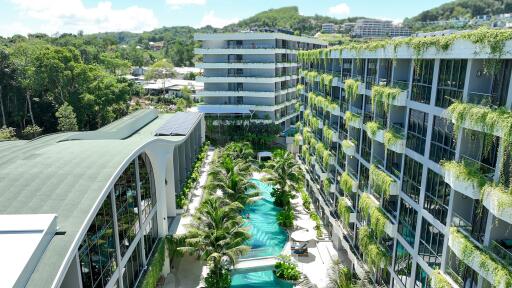 Exterior view of modern apartment complex with swimming pool