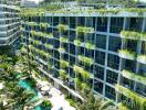 Modern multi-story building with greenery and swimming pool