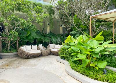 Outdoor seating area with green plants