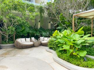 Outdoor seating area with green plants