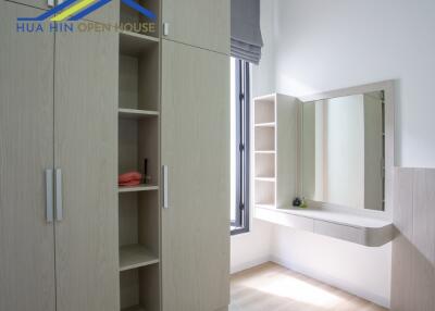 Bedroom with built-in wardrobe and dressing area