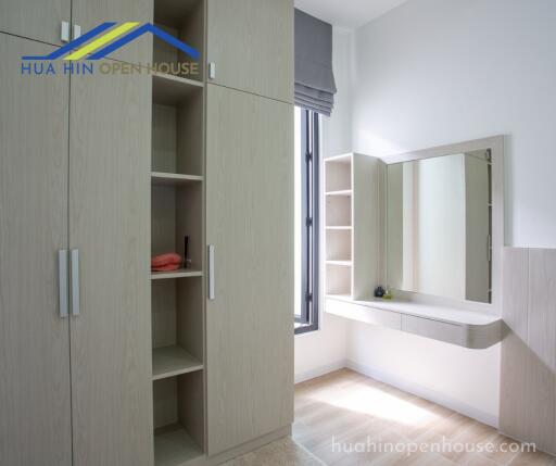 Bedroom with built-in wardrobe and dressing area