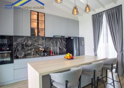 Modern kitchen with island and high stools