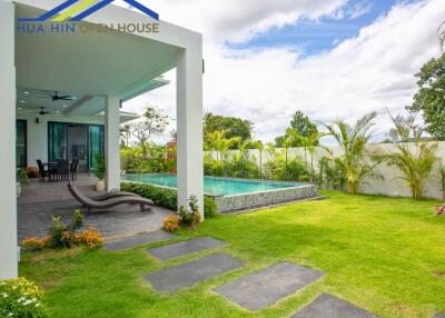 Outdoor area with pool and garden