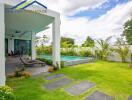 Outdoor area with pool and garden