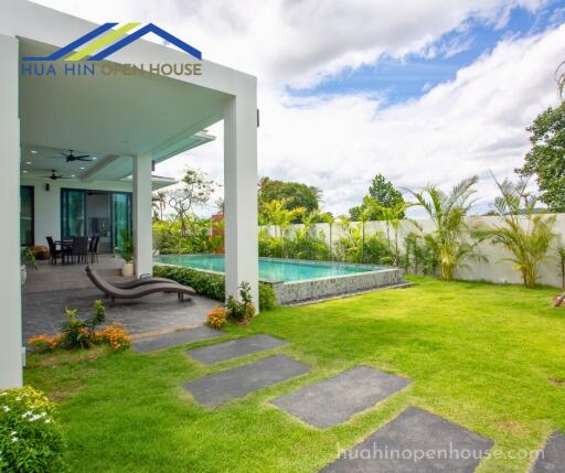 Outdoor area with pool and garden