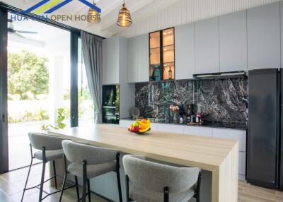 Modern kitchen with island and elegant lighting