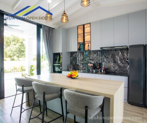 Modern kitchen with island and elegant lighting