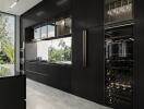 Modern kitchen with black cabinetry and wine cooler