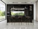 Modern kitchen with black cabinetry and island